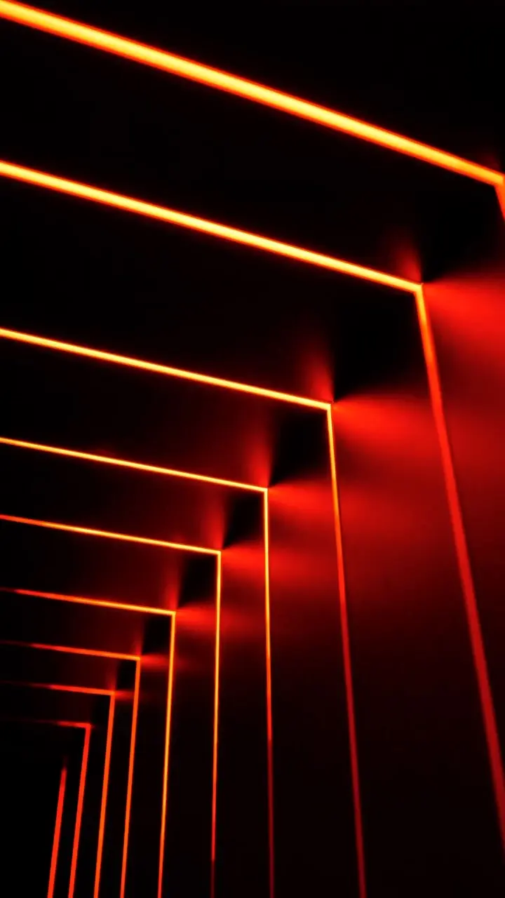 Gros plan d'un design lumière architectural : cadres lumineux orange et rouge en perspective, effet de tunnel.